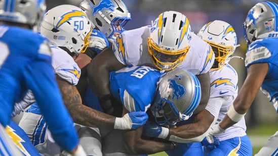 Detroit Lions quarterback Hendon Hooker (2) is sacked by Los Angeles Chargers linebacker Caleb Murphy (50), TeRah Edwards (94) and safety Emany Johnson, right, in the second half of the Pro Football Hall of Fame NFL preseason game Thursday, July 31, 2025, in Canton, Ohio.(AP)