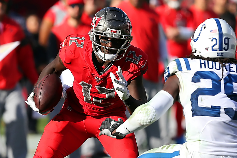 TAMPA, FL - DEC 08: Chris Godwin (12) of the Bucs gets some additional yardage after the catch during the regular season game between the Indianapolis Colts and the Tampa Bay Buccaneers on December 08, 2019 at Raymond James Stadium in Tampa, Florida. (Photo by Cliff Welch/Icon Sportswire)