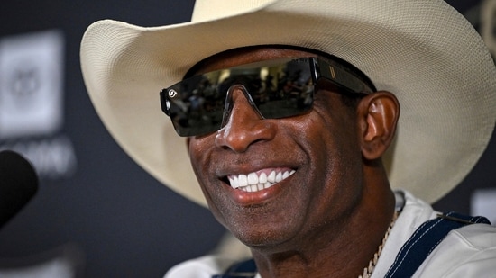 Deion Sanders smiles before speaking about his journey in beating bladder cancer during a press conference on July 28.(AP)