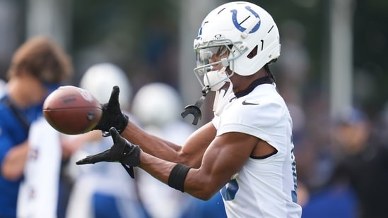 Indianapolis Colts wide receiver Adonai Mitchell (10) makes a catch during practice at the NFL football team's training camp in Westfield, Ind., Friday, July 25, 2025. (AP Photo/Michael Conroy)