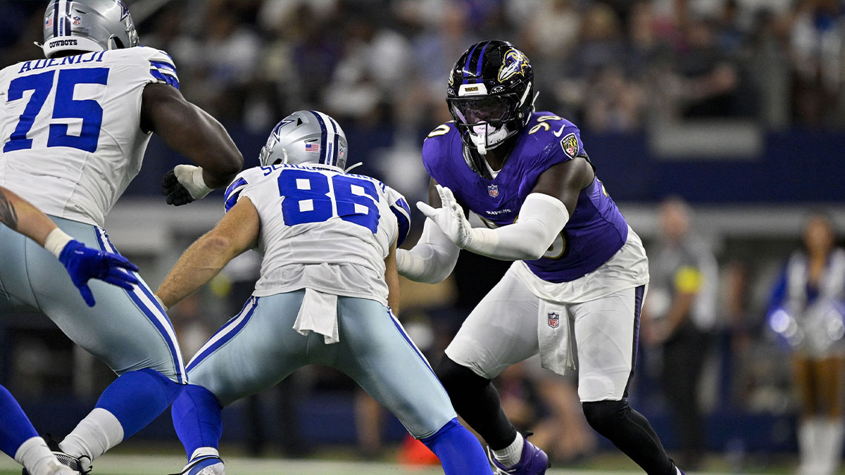 Dallas Cowboys tight end Luke Schoonmaker (86) and Baltimore Ravens linebacker David Ojabo (90) in action during the game between the Dallas Cowboys and the Baltimore Ravens at AT&T Stadium.