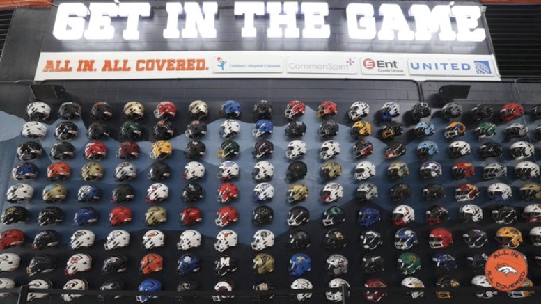Before last Saturday's preseason game at Empower Field at Mile High, the Denver Broncos celebrated a new and improved high school football wall promoting tackle and flag football.