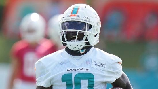 Miami Dolphins wide receiver Tyreek Hill (10) runs with the football during practice at the NFL football team's training camp, Saturday, July 26, 2025, in Miami Gardens, Fla. (AP Photo/Lynne Sladky)(AP)