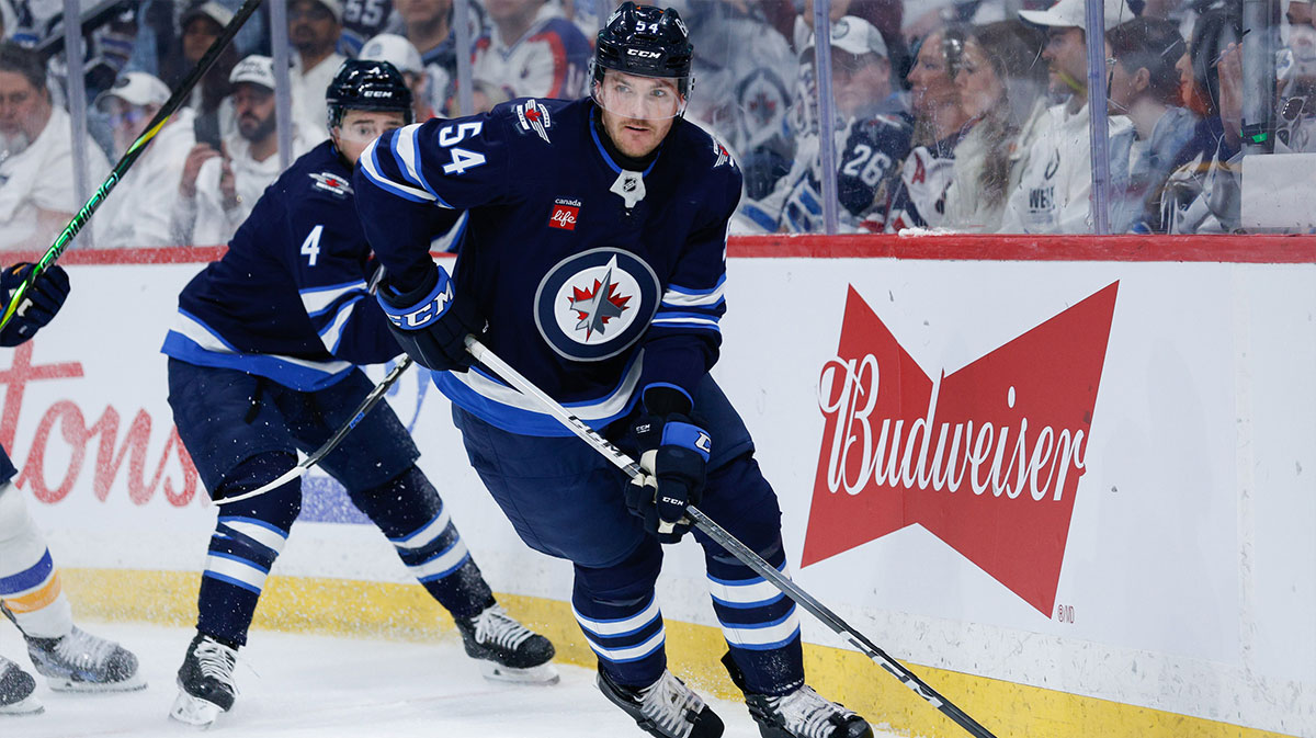 Winnipeg Jets defenseman Dylan Samberg (54) looks to make a pass against St. Louis Blues during the first period in game one of the first round of the 2025 Stanley Cup Playoffs at Canada Life Centre.