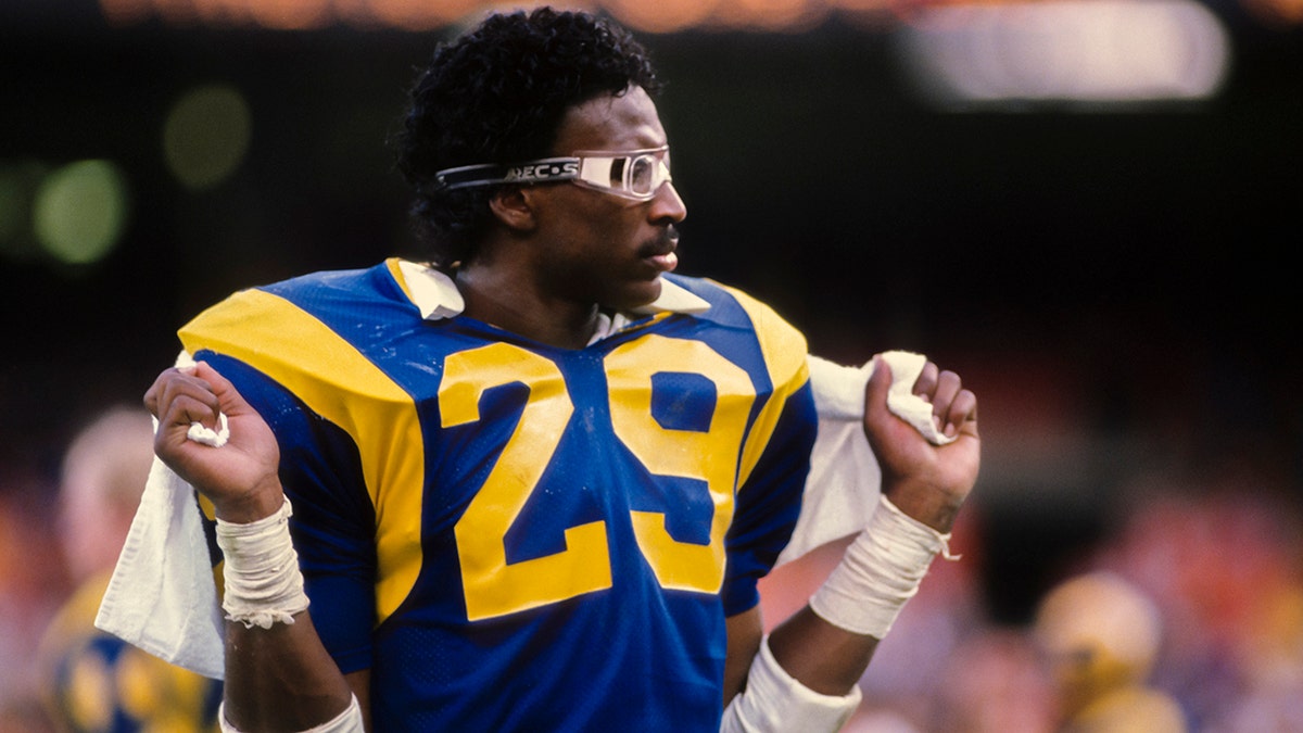 FILE - Eric Dickerson #29 of the Los Angeles Rams waits on the sidelines during a National Football League game against the Houston Oilers played on December 17, 1984, at Anaheim Stadium in Anaheim, California.