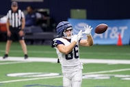 Dallas Cowboys tight end Luke Schoonmaker (86) receives a ball during a drill in an open to...