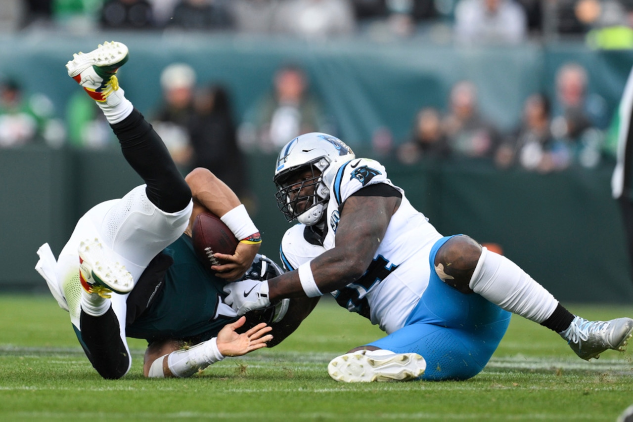 Carolina Panthers defensive end A’Shawn Robinson sacks Philadelphia Eagles quarterback Jalen Hurts