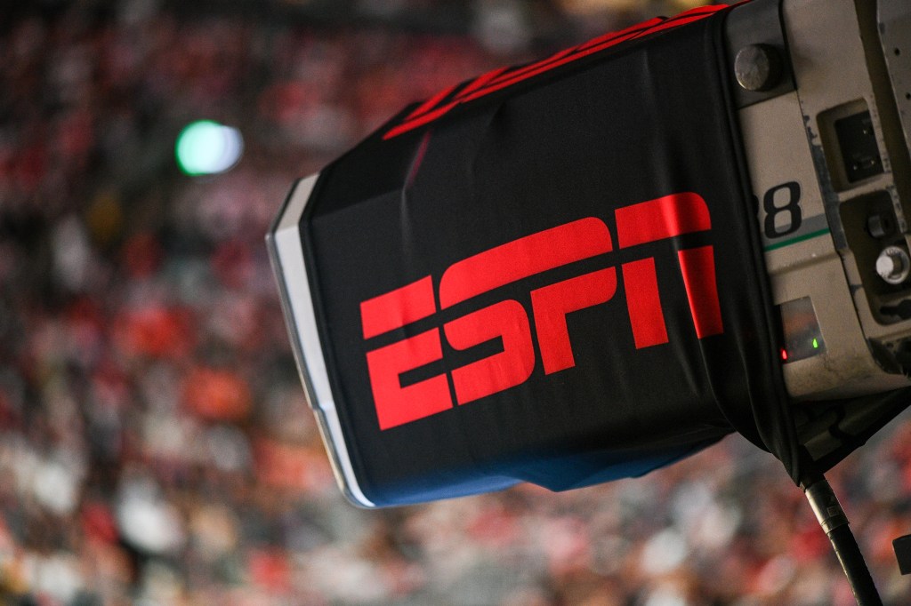 ESPN logo on a camera at a basketball game.
