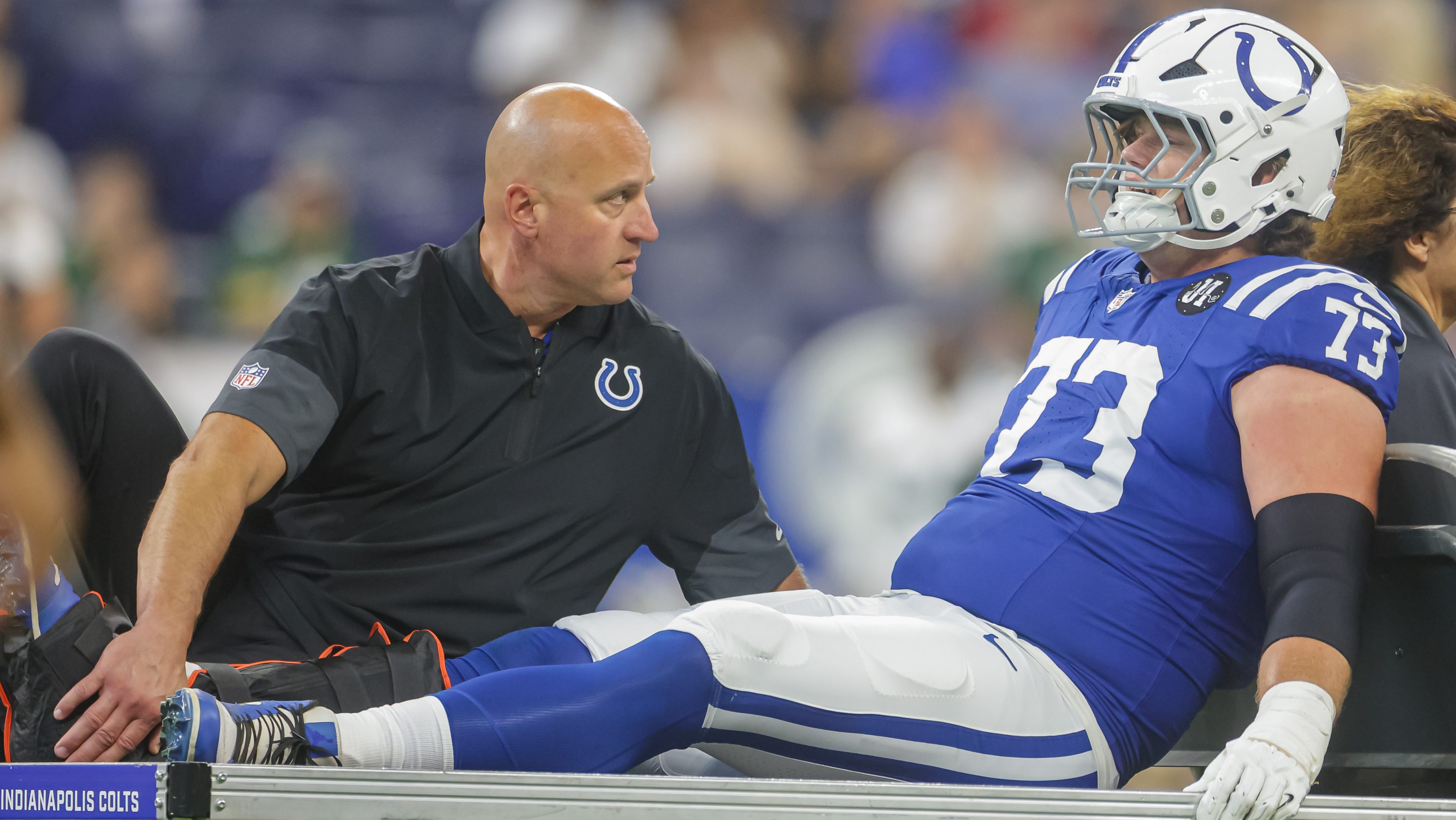 Blake Freeland being carted off the field with a broken leg.