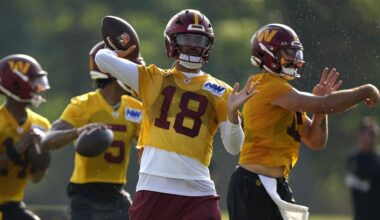 Marcus Mariota, middle, a Saint Louis School graduate, Washington Commanders quarterback Marcus Mariota threw the ball during practice at the team's football training camp on July 27 in Ashburn, Va.