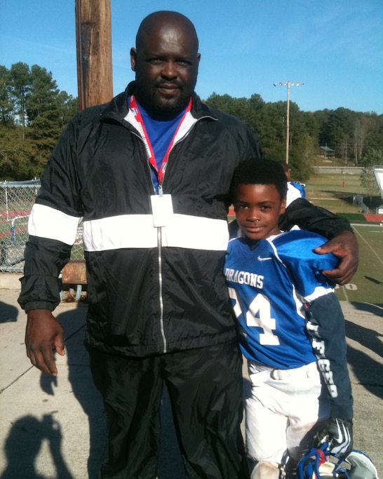 A young Malaki with his dad, Larry Starks, who helped coach TK YOUTH TEAM?