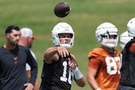 Texas quarterback Arch Manning (16) throws during an NCAA college football practice in...