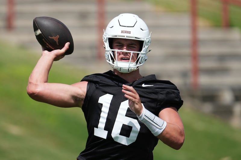 Texas quarterback Arch Manning (16) throws during a practice in Austin, Texas, Wednesday, July 30, 2025.