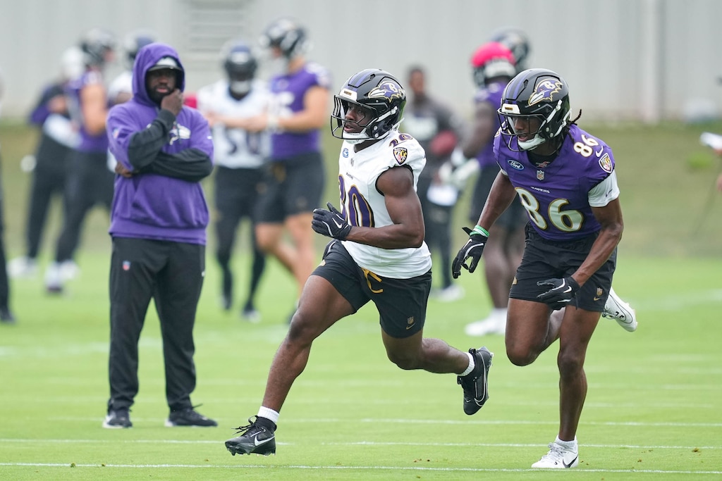 Baltimore Ravens cornerback Reuben Lowery III (30) runs from wide receiver Jahmal Banks (86) during a drill at the team’s mandatory minicamp at the Under Armour Performance Center in Owings Mills, Md. on Tuesday, June 17, 2025.