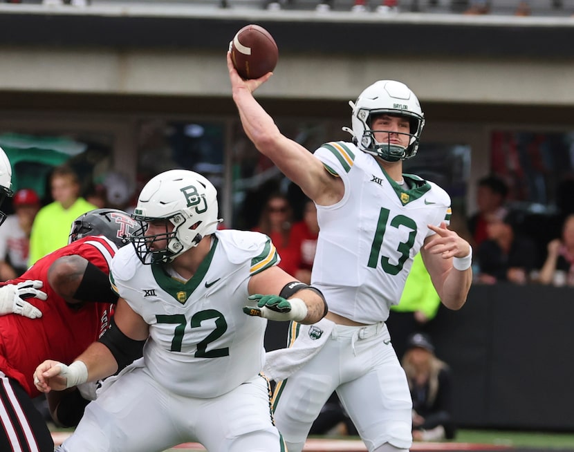 Baylor quarterback Sawyer Robertson throws downfield against Texas Tech with help from...
