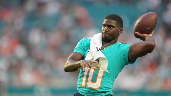 Miami Dolphins wide receiver Tyreek Hill (10) throws the football on the sidelines during the first half of an NFL preseason football game against the Jacksonville Jaguars, Saturday, Aug. 23, 2025, in Miami Gardens, Fla.(AP)