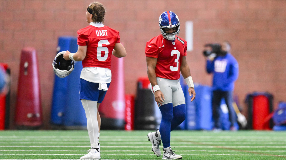 New York Giants quarterback Jaxson Dart (6) and quarterback Russell Wilson (3) interact during minicamp at Quest Diagnostics Training Center.