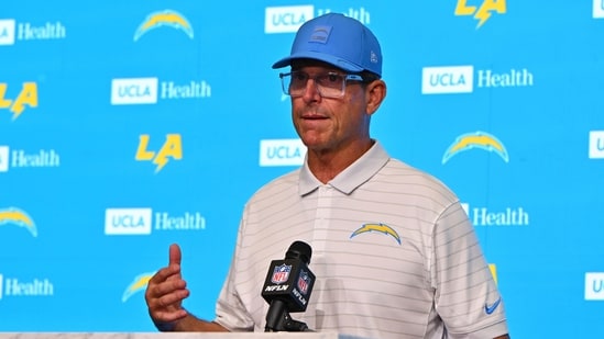 Los Angeles Chargers head coach Jim Harbaugh answers questions after a preseason NFL football game against the New Orleans Saints(AP)