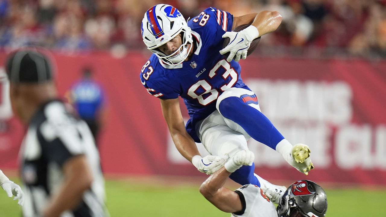Buffalo Bills tight end Keleki Latu goes over Tampa Bay Buccaneers cornerback Roman Parodie during the second half of an NFL preseason football game, Saturday, Aug. 23, 2025, in Tampa, Fla. (AP Photo/Chris O'Meara)
