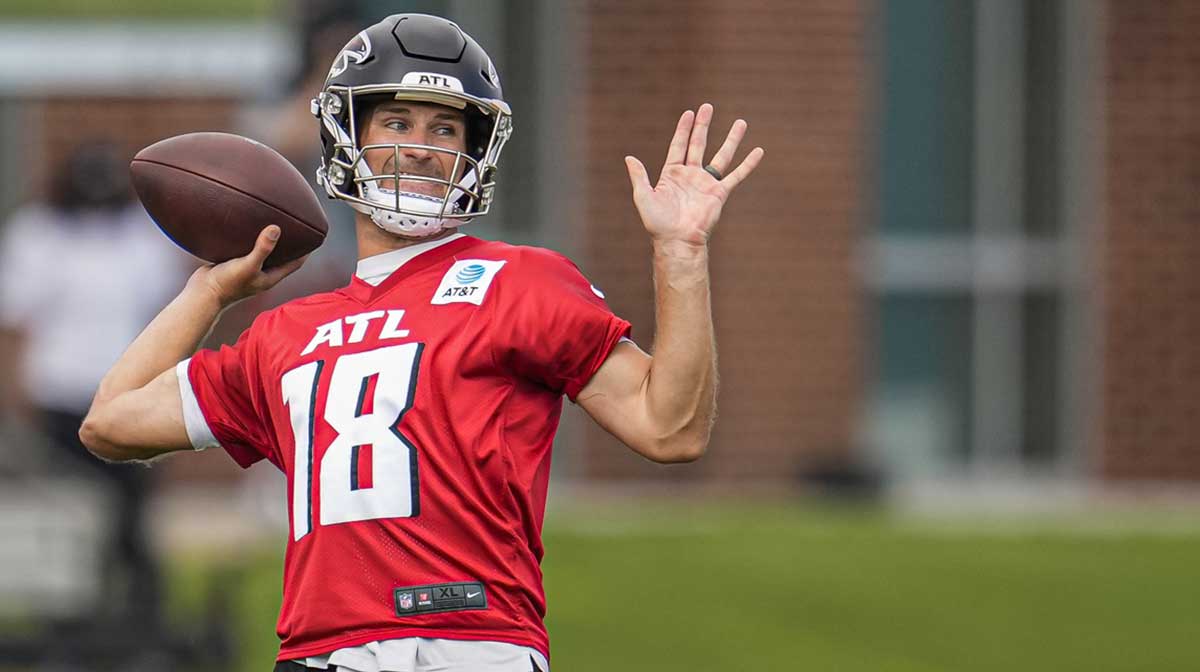 Atlanta Falcons quarterback Kirk Cousins (18) passes during training camp at IBM Performance Field.