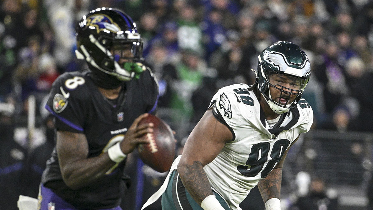 Philadelphia Eagles defensive tackle Jalen Carter (98) applies pressure on Baltimore Ravens quarterback Lamar Jackson (8) during the game at M&T Bank Stadium.