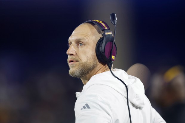 Central Michigan head coach Matt Drinkall looks on from the...
