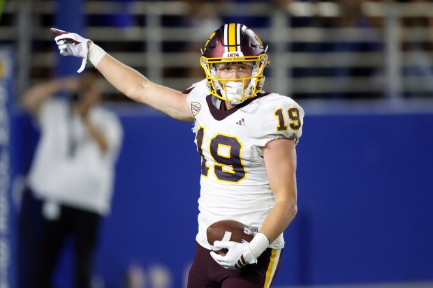 Central Michigan wide reciever Tommy McIntosh (19) reacts after making...