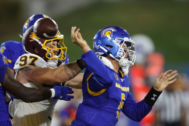 Central Michigan defensive lineman Michael Heldman (97) causes a fumble...