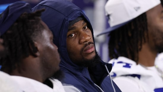 Micah Parsons #11 of the Dallas Cowboys looks on from his team's bench during the first half of the NFL Preseason 2025 game against the Falcons(Getty Images via AFP)