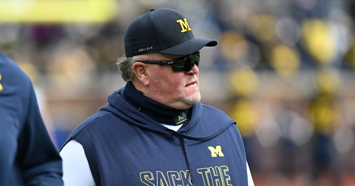 Michigan offensive coordinator Chip Lindsey, left, and offensive line coach Grant Newsome watch warm up before the spring game at Michigan Stadium in Ann Arbor on Saturday, April 19, 2025.