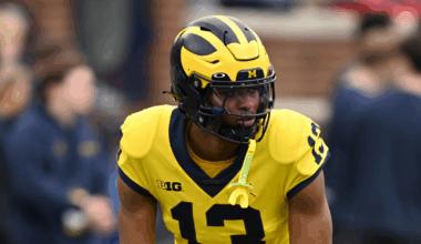 Michigan offensive coordinator Chip Lindsey, left, and offensive line coach Grant Newsome watch warm up before the spring game at Michigan Stadium in Ann Arbor on Saturday, April 19, 2025.