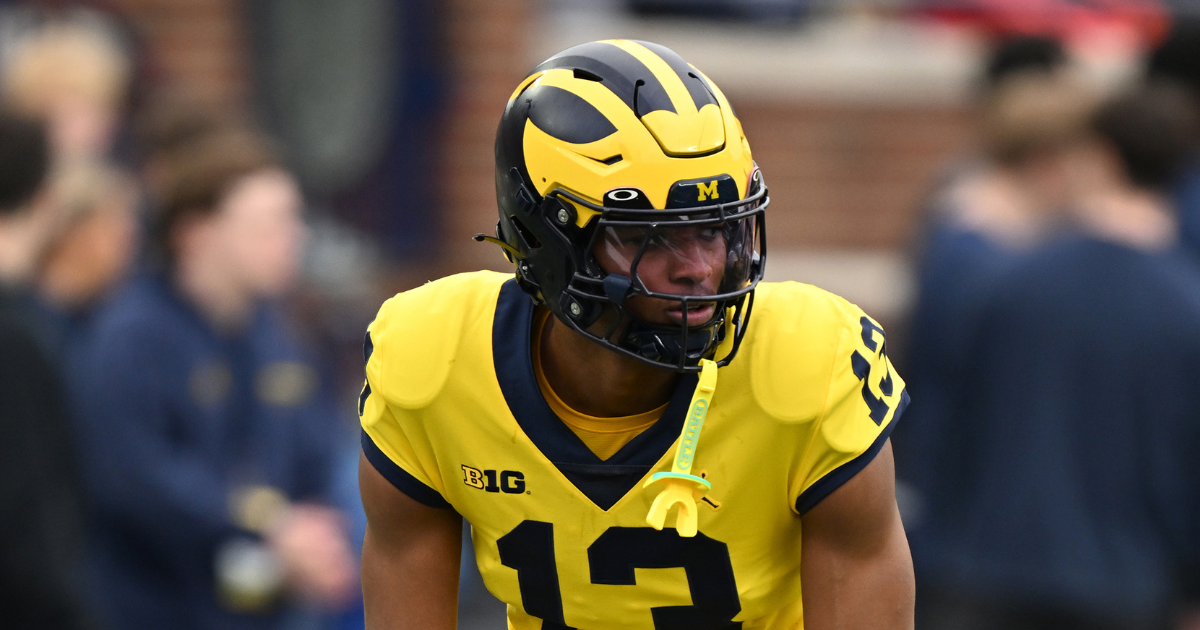 Michigan offensive coordinator Chip Lindsey, left, and offensive line coach Grant Newsome watch warm up before the spring game at Michigan Stadium in Ann Arbor on Saturday, April 19, 2025.