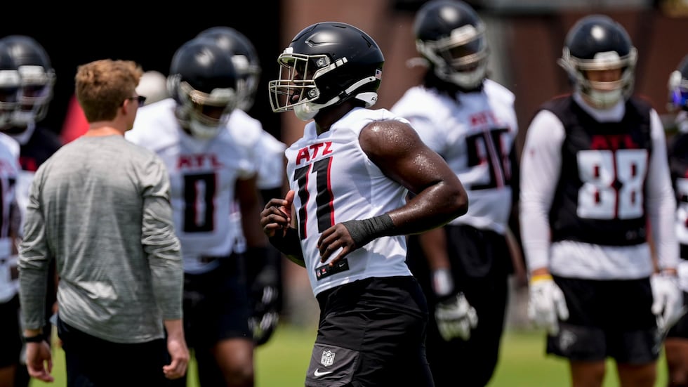 FILE - Atlanta Falcons linebacker Jalon Walker (11) works out during practice at NFL football...