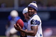 Dallas Cowboys defensive end Micah Parsons stands on the field during a training camp...