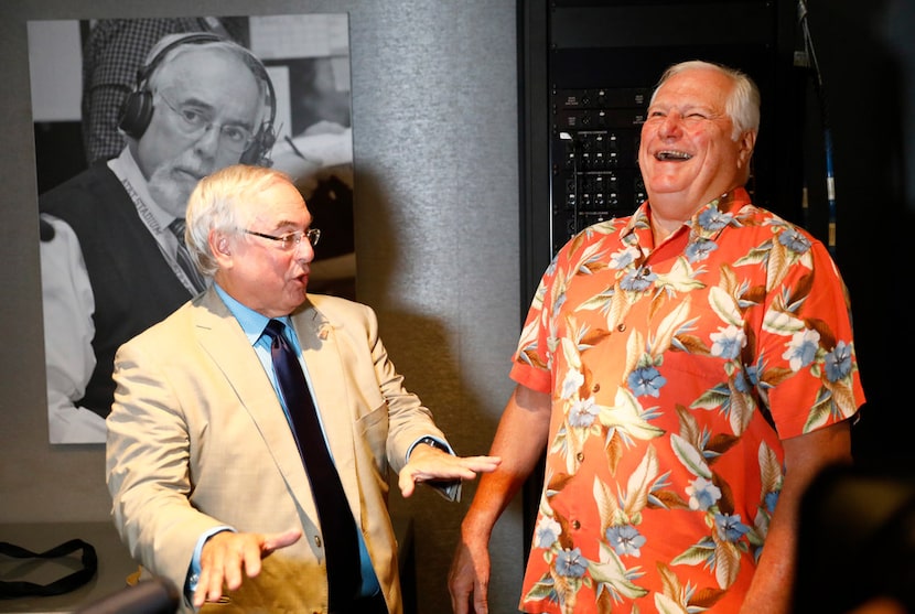 Dale Hansen (right) laughs with broadcaster Brad Sham at a celebration in Sham's honor....