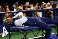 Dallas Cowboys defensive end Micah Parsons lays on a training table during the second half...