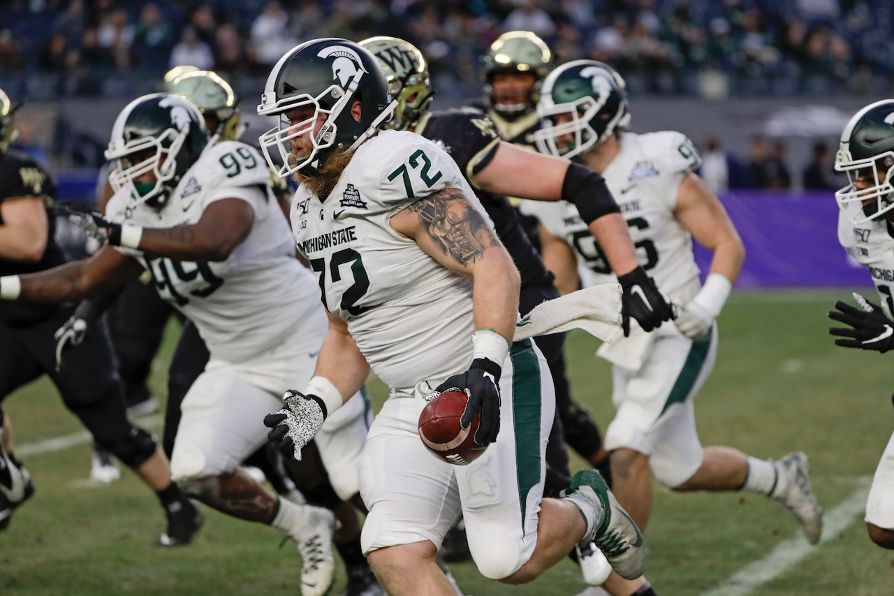 Former Michigan State defender turned O-lineman waived by Saints