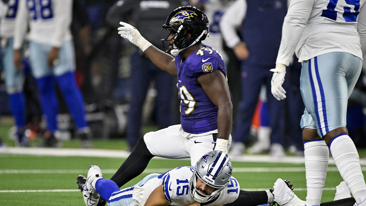 Baltimore Ravens linebacker Jay Higgins IV (49) sacks Dallas Cowboys quarterback Will Grier (15) during the second half at AT&T Stadium.