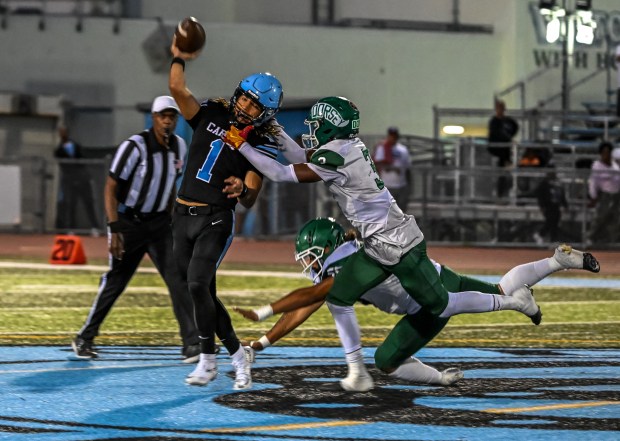 Carson High quarterback Chris Fields throws the ball during the...