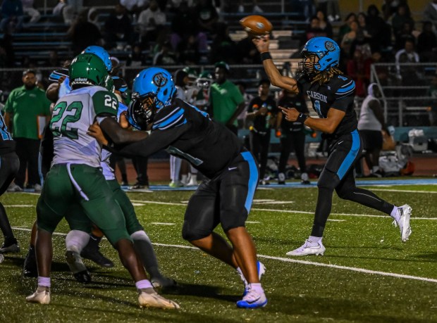 Carson High quarterback Chris Fields throws the ball during the...