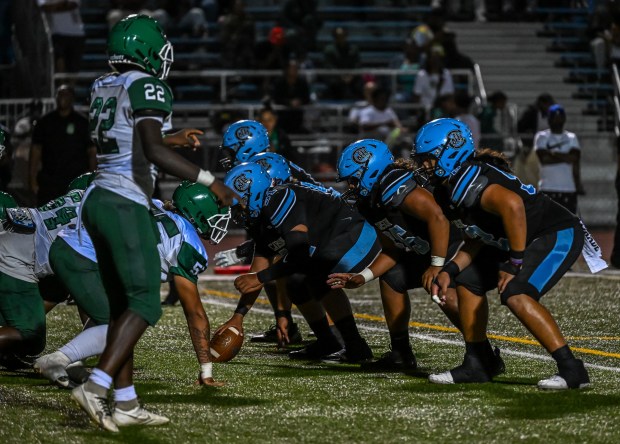 The Carson High offense lines up ahead of the snap...