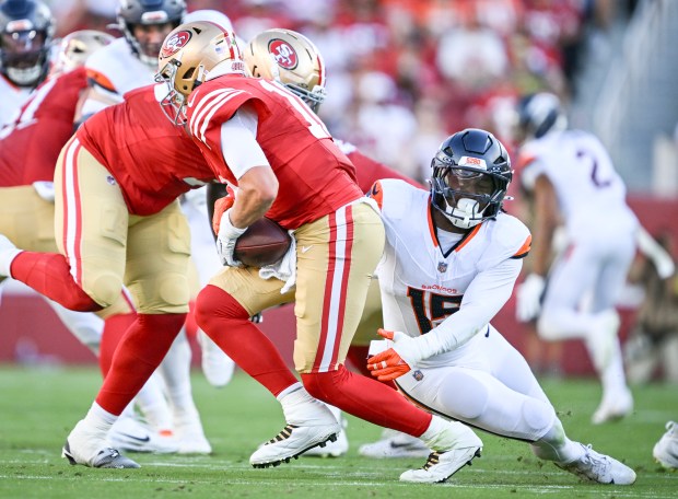 Nik Bonitto (15) of the Denver Broncos narrowly misses a sack as Mac Jones (10) of the San Francisco 49ers moves during the first quarter at Levi's Stadium in Santa Clara, California, on Saturday, Aug. 9, 2025. (Photo by AAron Ontiveroz/The Denver Post)
