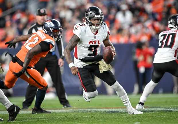 Michael Penix Jr. (9) of the Atlanta Falcons scrambles against the Denver Broncos during the fourth quarter at Empower Field at Mile High in Denver on Sunday, Nov. 17, 2024. (Photo by AAron Ontiveroz/The Denver Post)