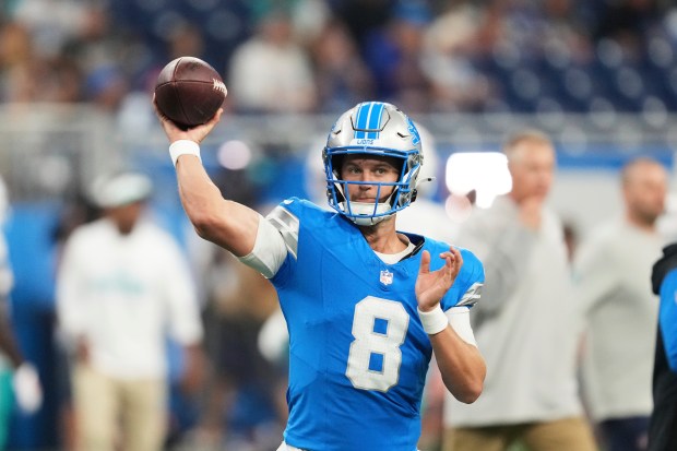 Detroit Lions quarterback Kyle Allen (8) warms up before an...