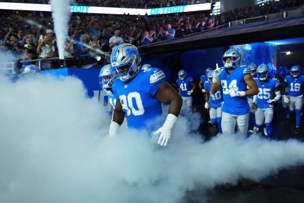 The Detroit Lions enter the field before an NFL preseason...