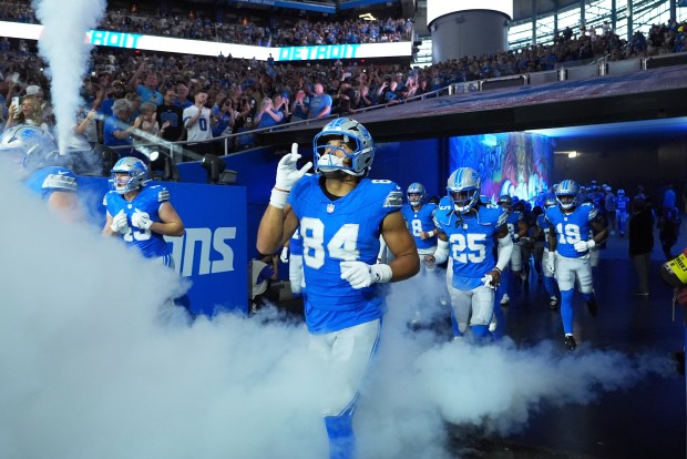 The Detroit Lions enter the field before an NFL preseason...
