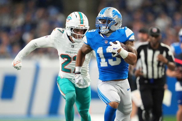 Detroit Lions running back Craig Reynolds (13) carries against Miami...