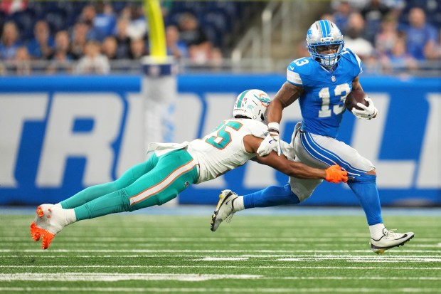 Detroit Lions running back Craig Reynolds (13) carries against Miami...