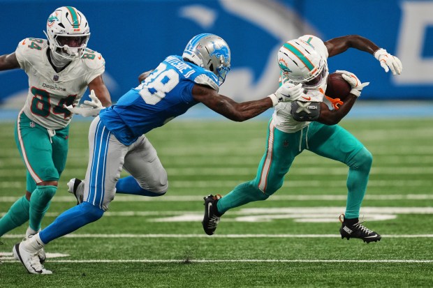 Miami Dolphins wide receiver Tahj Washington (7) carries against Detroit...