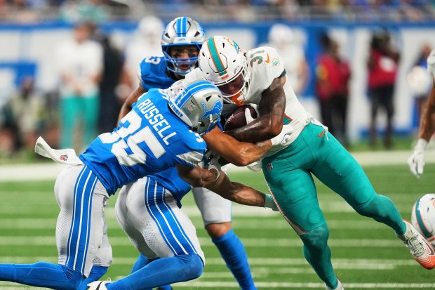 Miami Dolphins running back Ollie Gordon II (31) carries against...